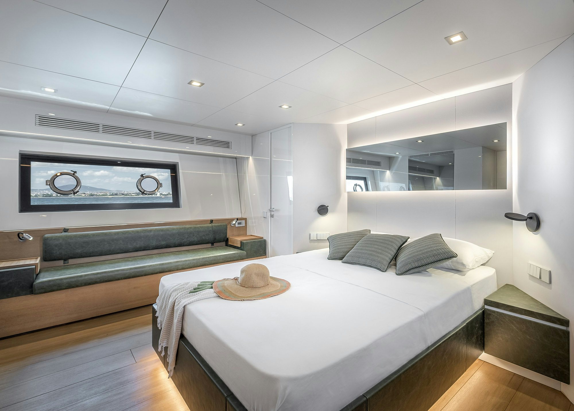 a room with a bed and a television on the wall aboard IGUAZU Yacht for Sale