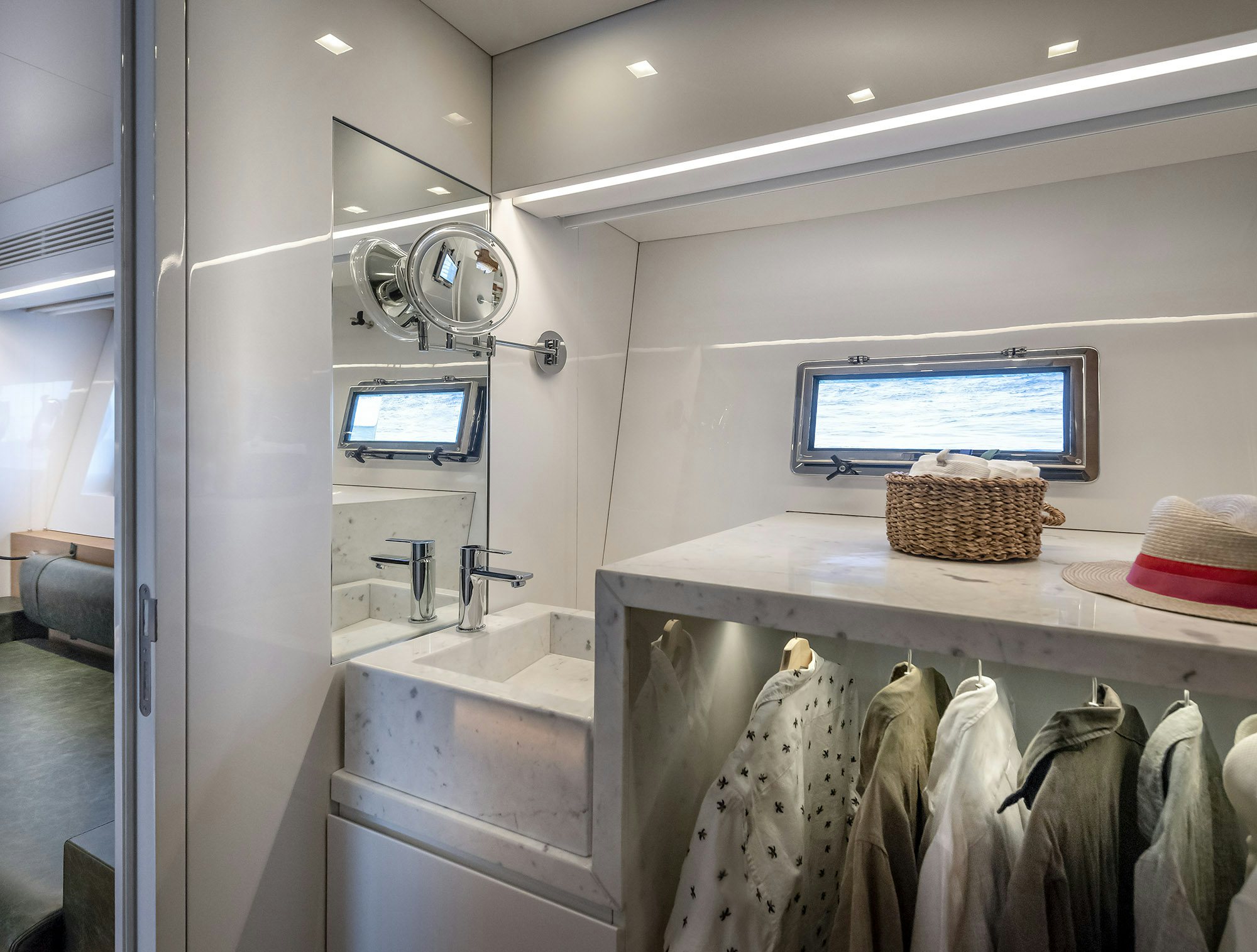 a bathroom with a large mirror aboard IGUAZU Yacht for Sale