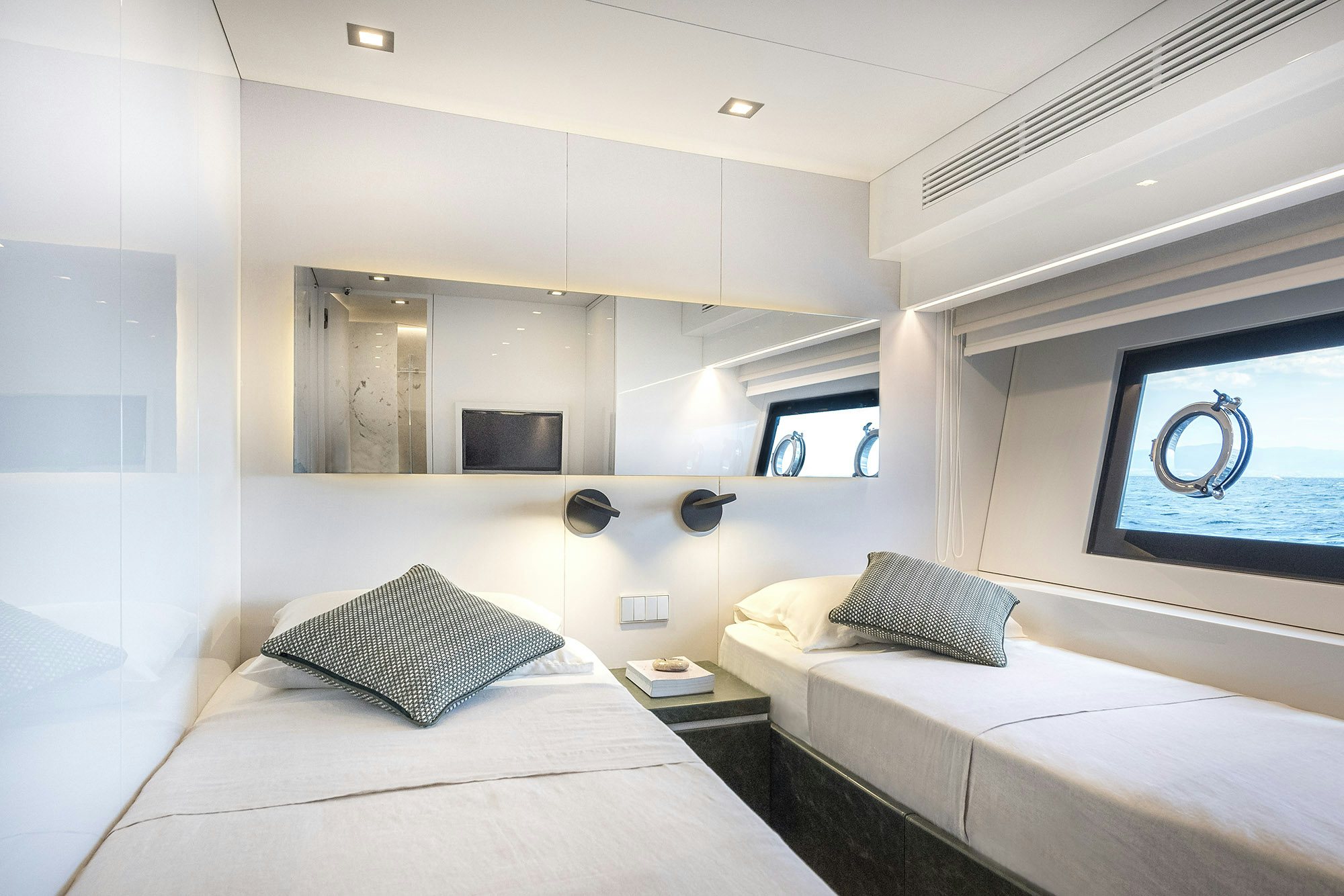 a room with two beds aboard IGUAZU Yacht for Sale