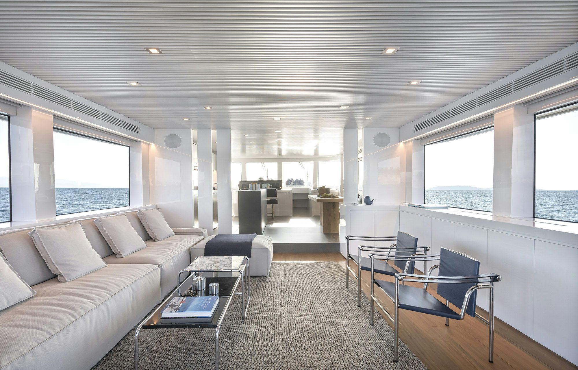 a living room with a couch and a table aboard IGUAZU Yacht for Sale