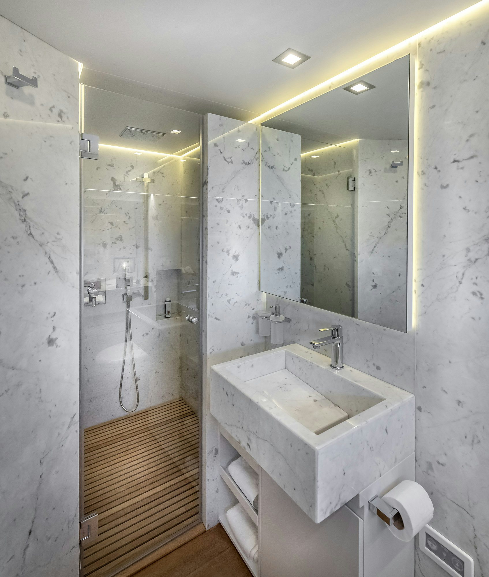 a bathroom with a sink and a mirror aboard IGUAZU Yacht for Sale