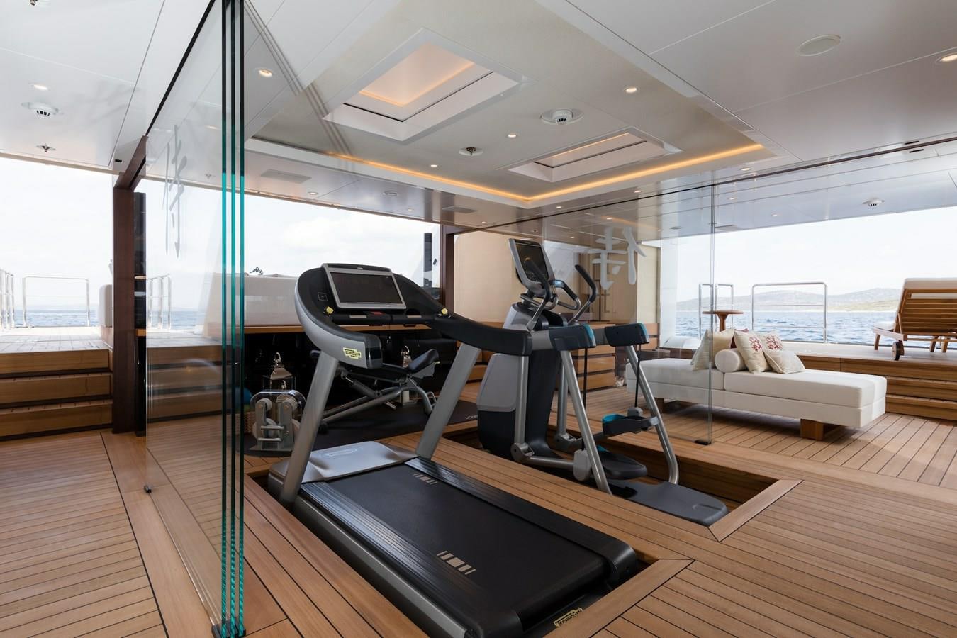 a gym with a bench aboard SAMURAI Yacht for Sale
