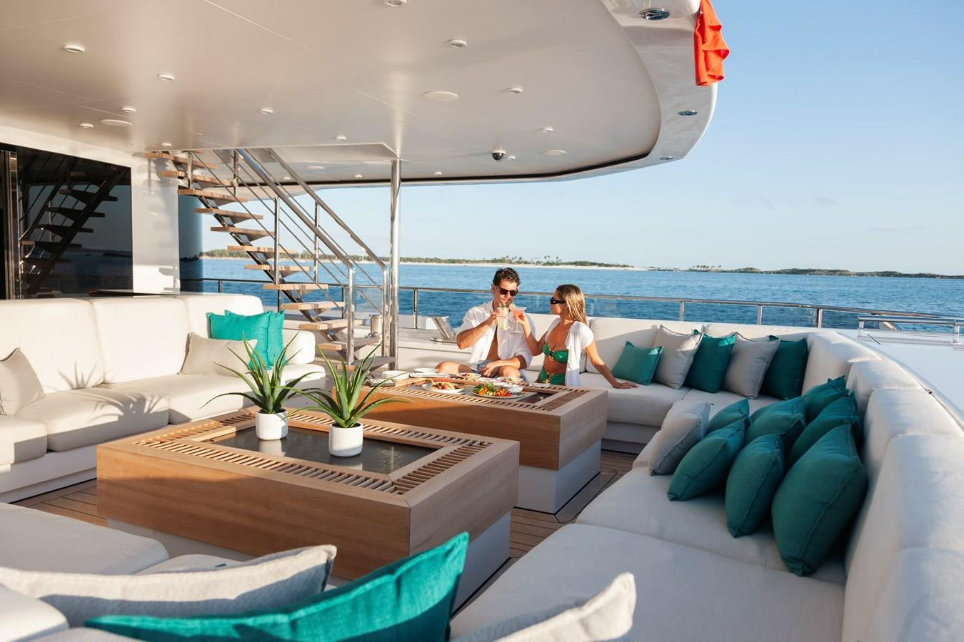 a couple sitting on a couch aboard SAMURAI Yacht for Sale
