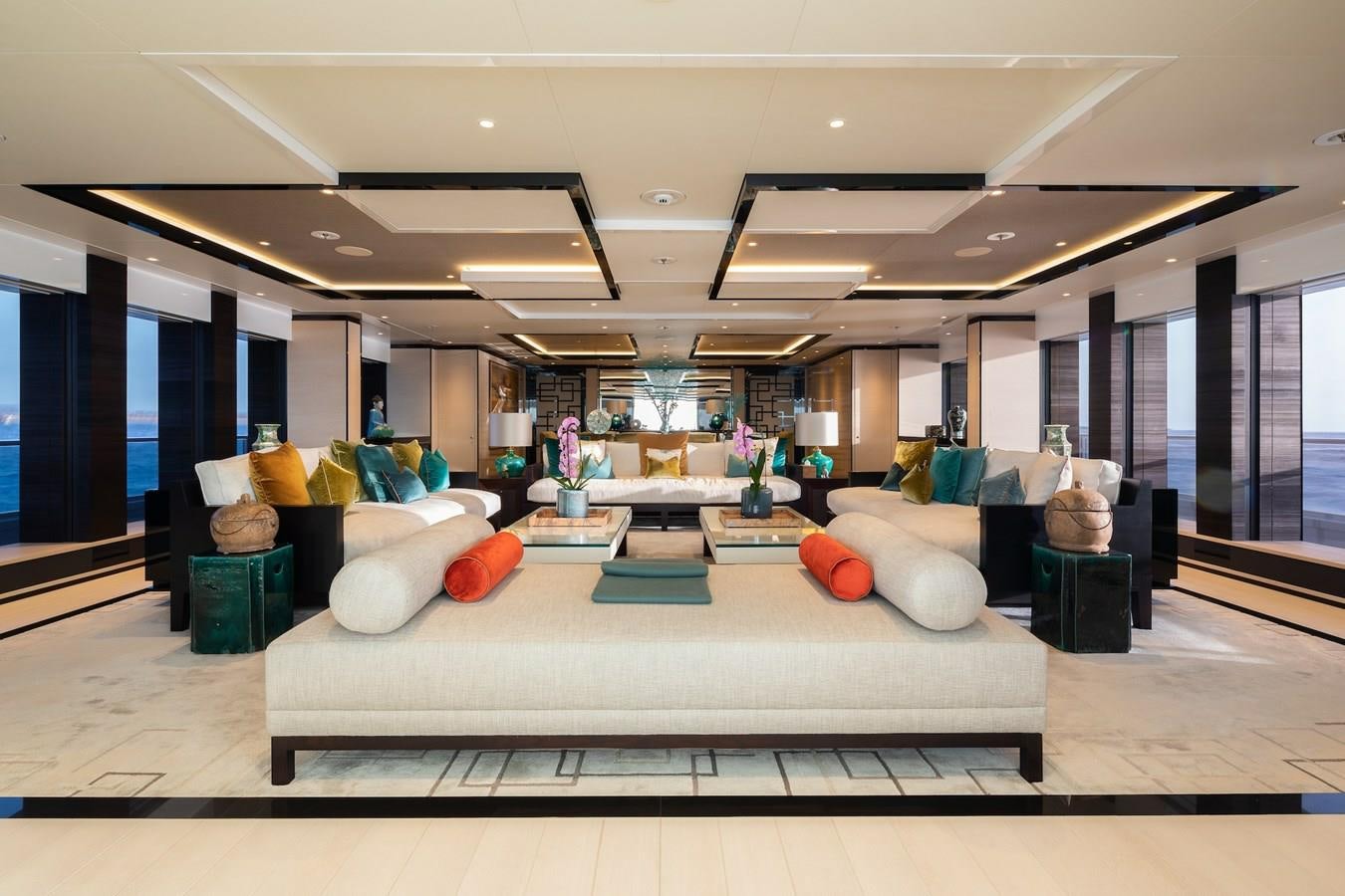 a large room with a couch and a table aboard SAMURAI Yacht for Sale