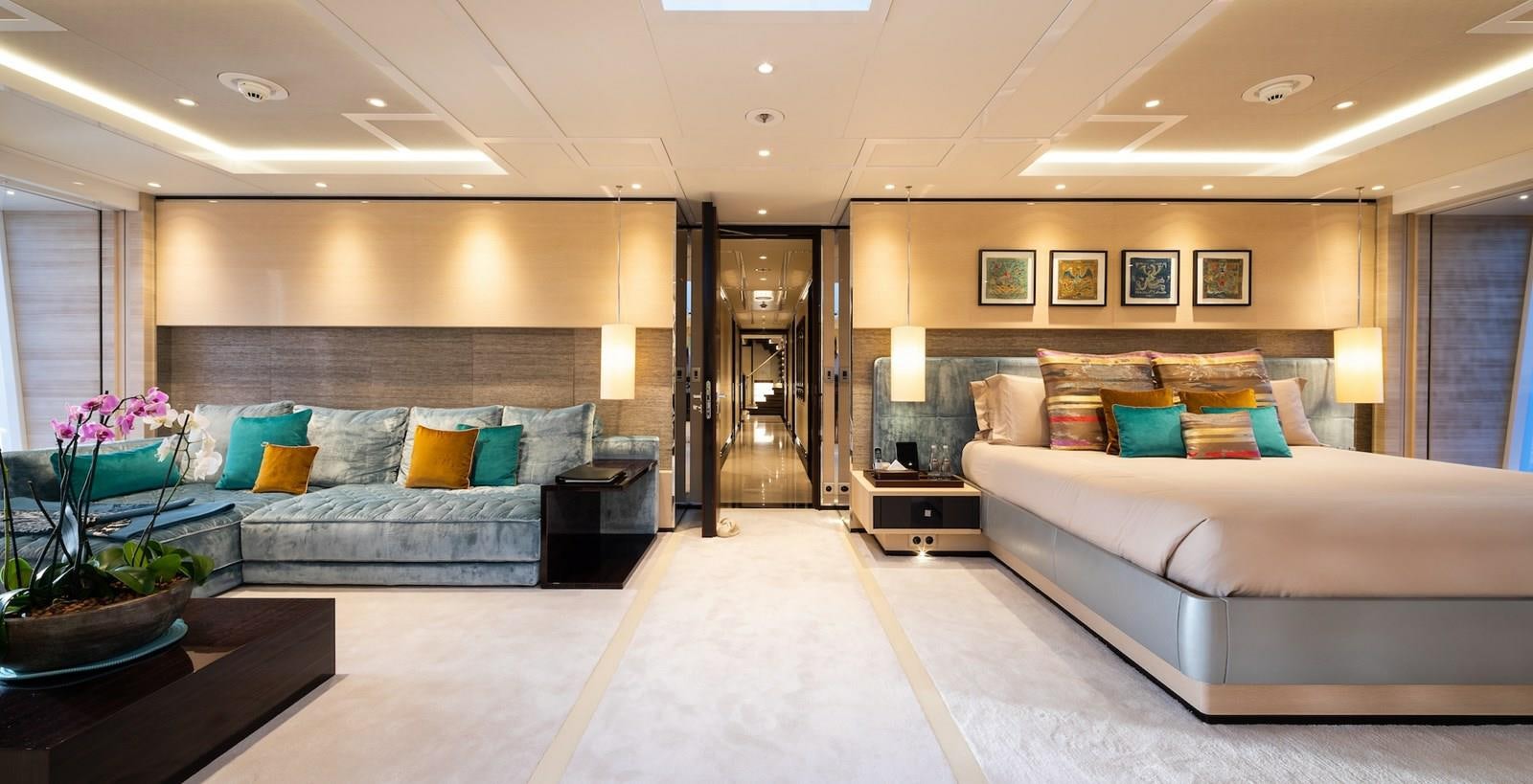 a large room with a bed and a couch aboard SAMURAI Yacht for Sale