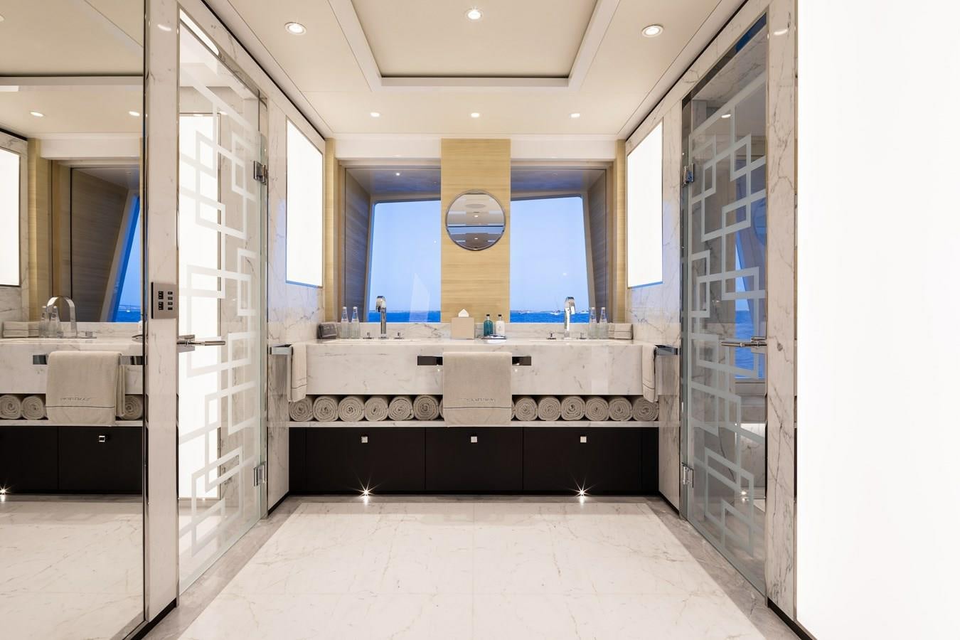 a bathroom with a large mirror aboard SAMURAI Yacht for Sale