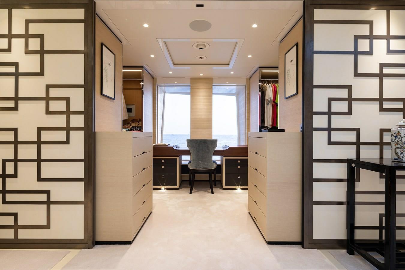 a room with a desk and chairs aboard SAMURAI Yacht for Sale