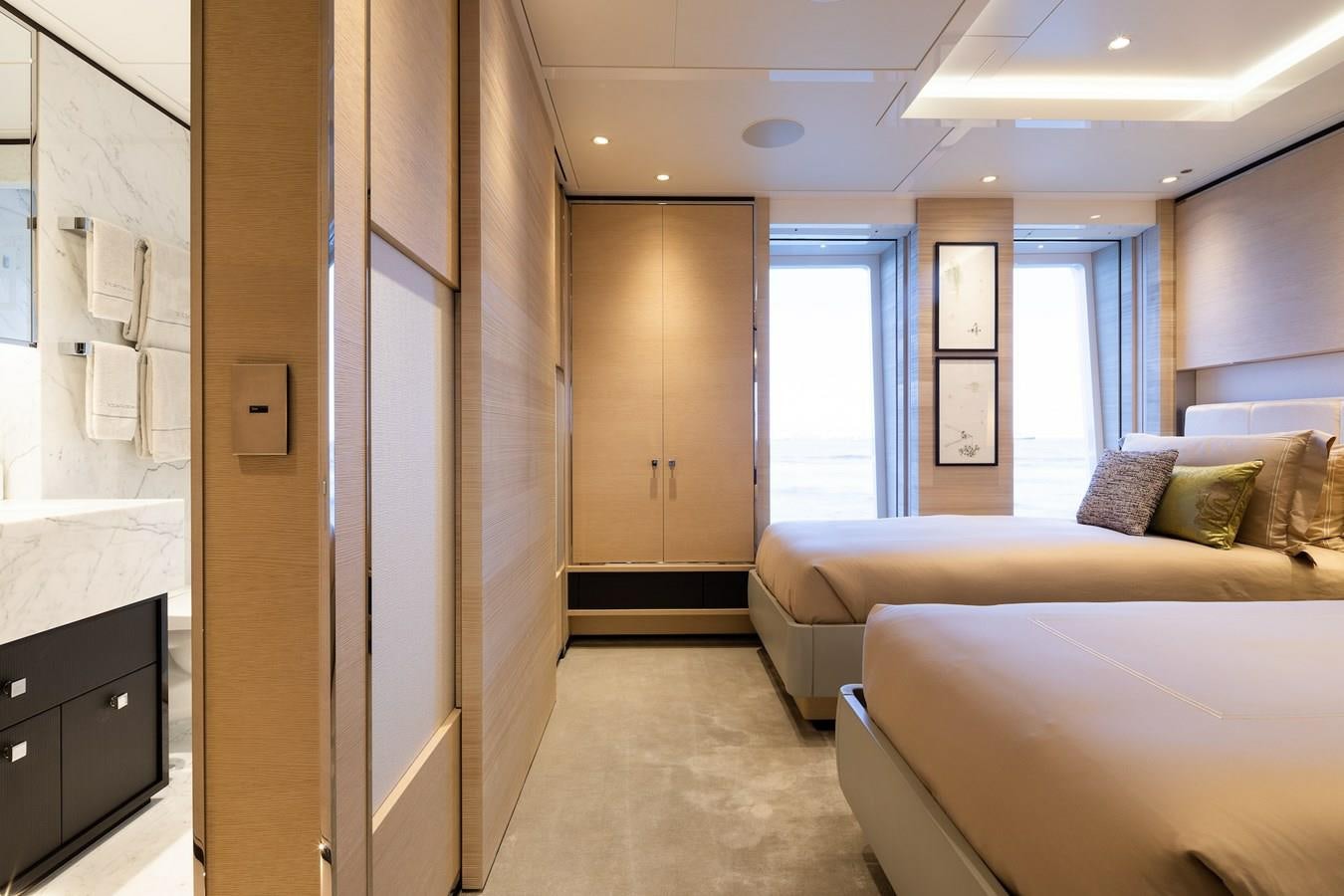 a room with a bed and a couch aboard SAMURAI Yacht for Sale