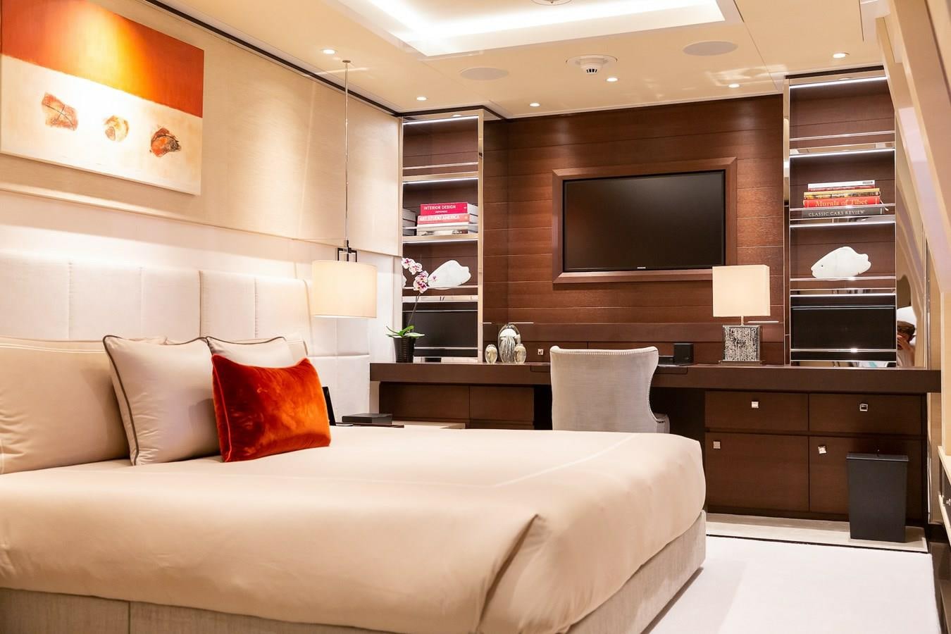 a bedroom with a bed and a tv aboard SAMURAI Yacht for Sale