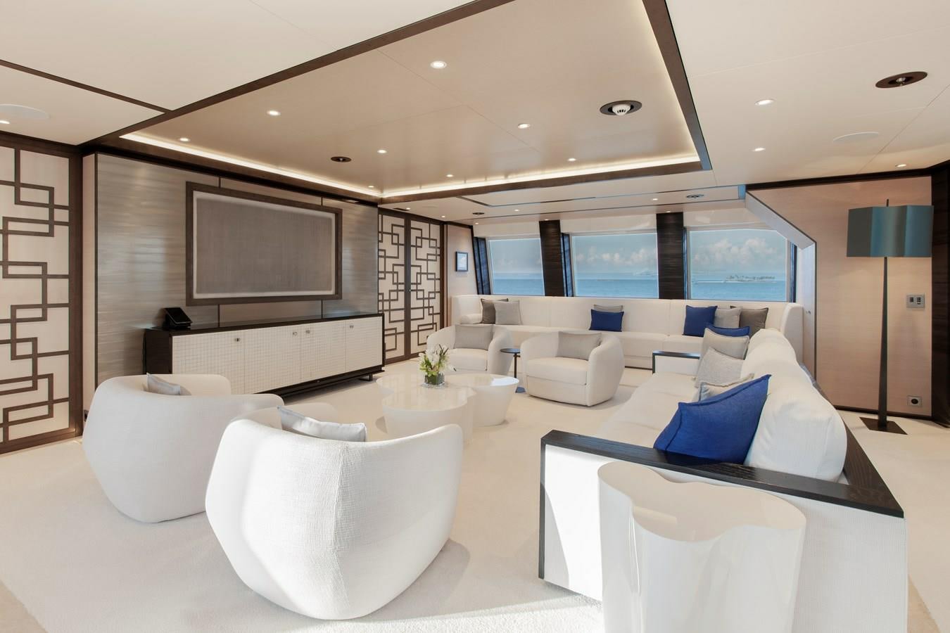 a room with white couches and a tv aboard SAMURAI Yacht for Sale