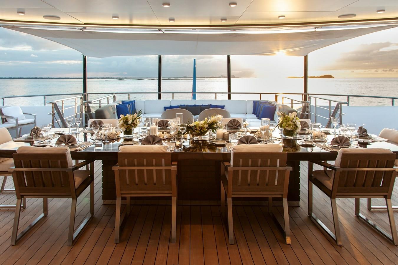 a room with tables and chairs aboard SAMURAI Yacht for Sale