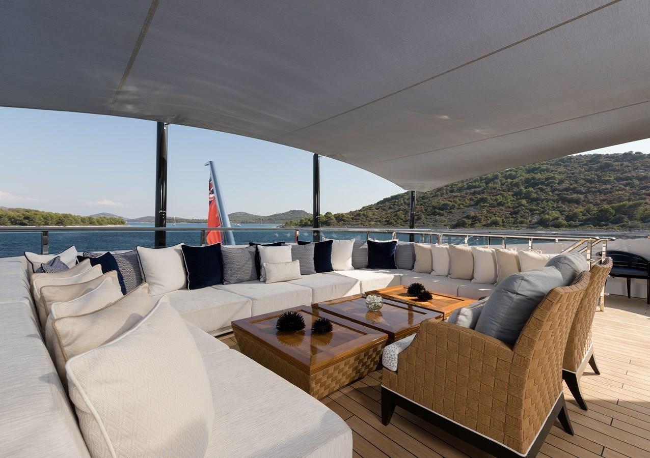 a large living room with a large patio and a large window aboard SAMURAI Yacht for Sale