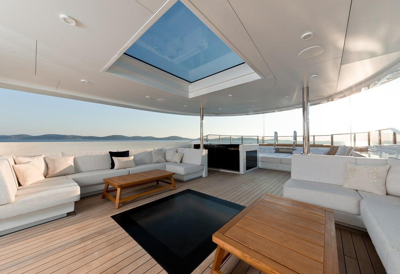 a living room with a large blue ceiling aboard SAMURAI Yacht for Sale
