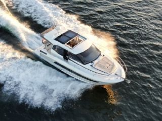 a car on a body of water aboard SUMMER HOME Yacht for Sale