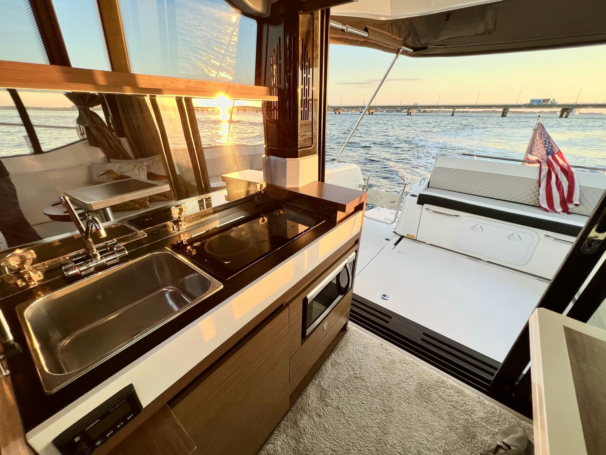 a kitchen with a sink and a window aboard SUMMER HOME Yacht for Sale