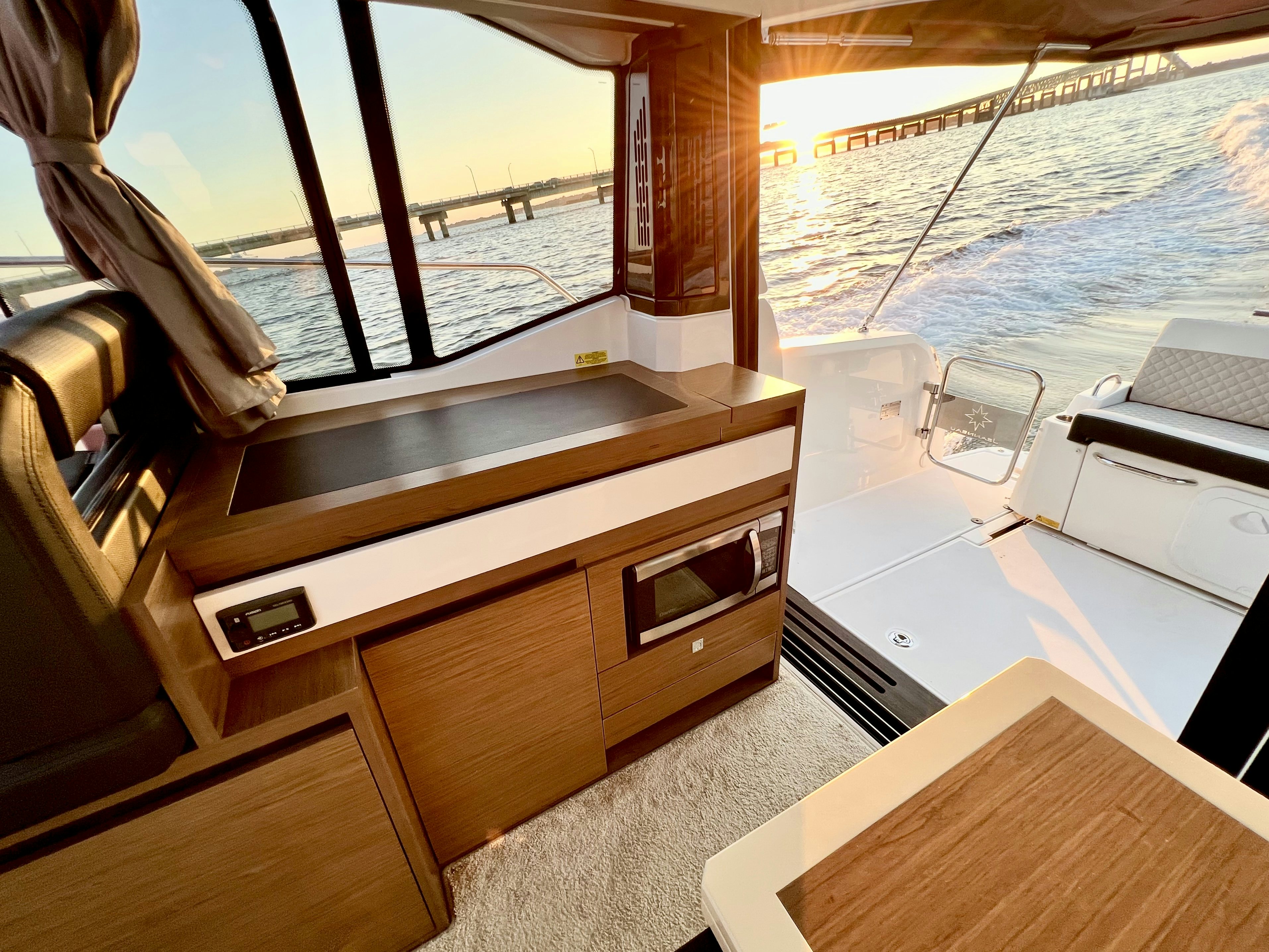 a kitchen with a large window aboard SUMMER HOME Yacht for Sale