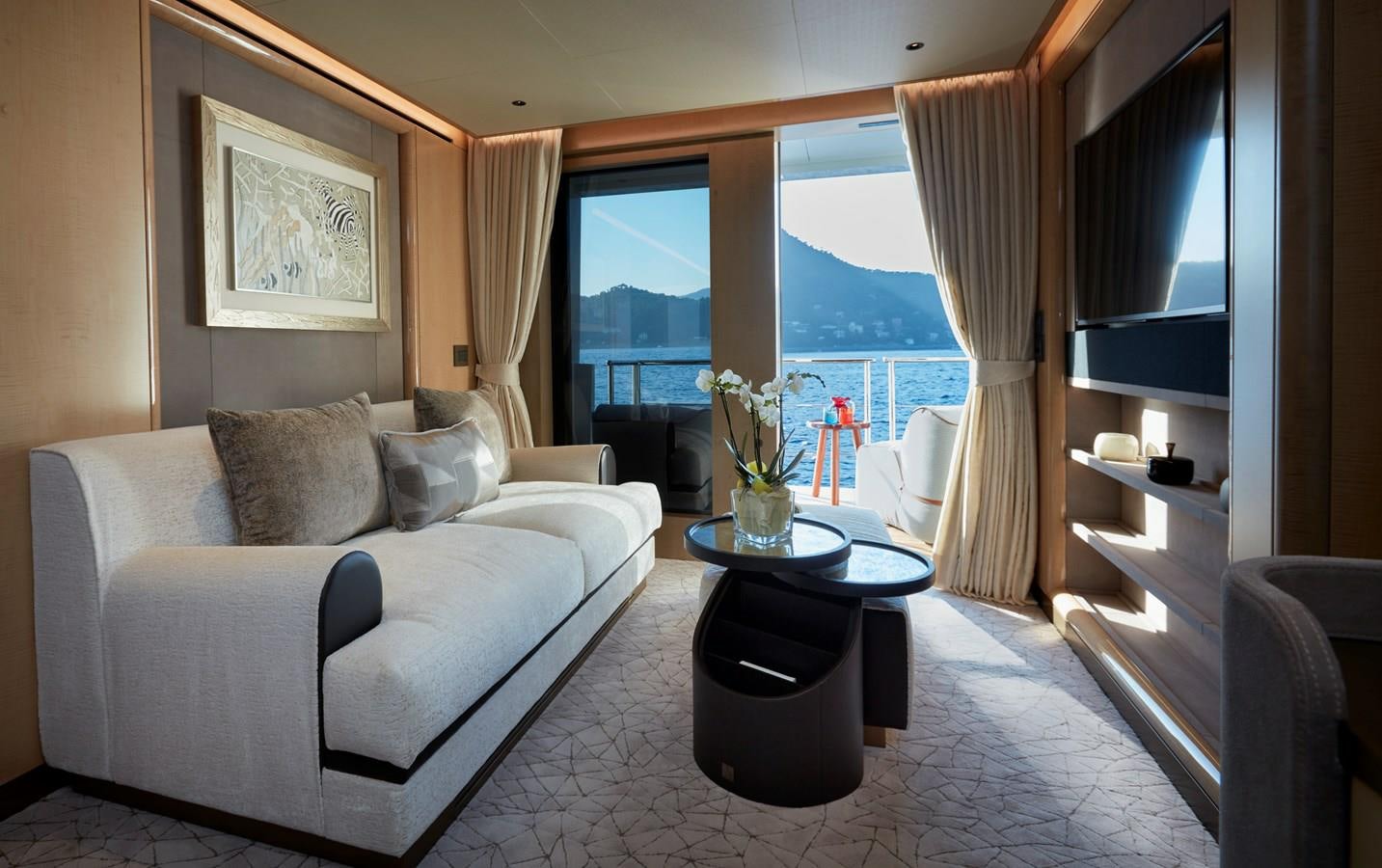 a living room with a large window aboard SOMNIUM Yacht for Sale