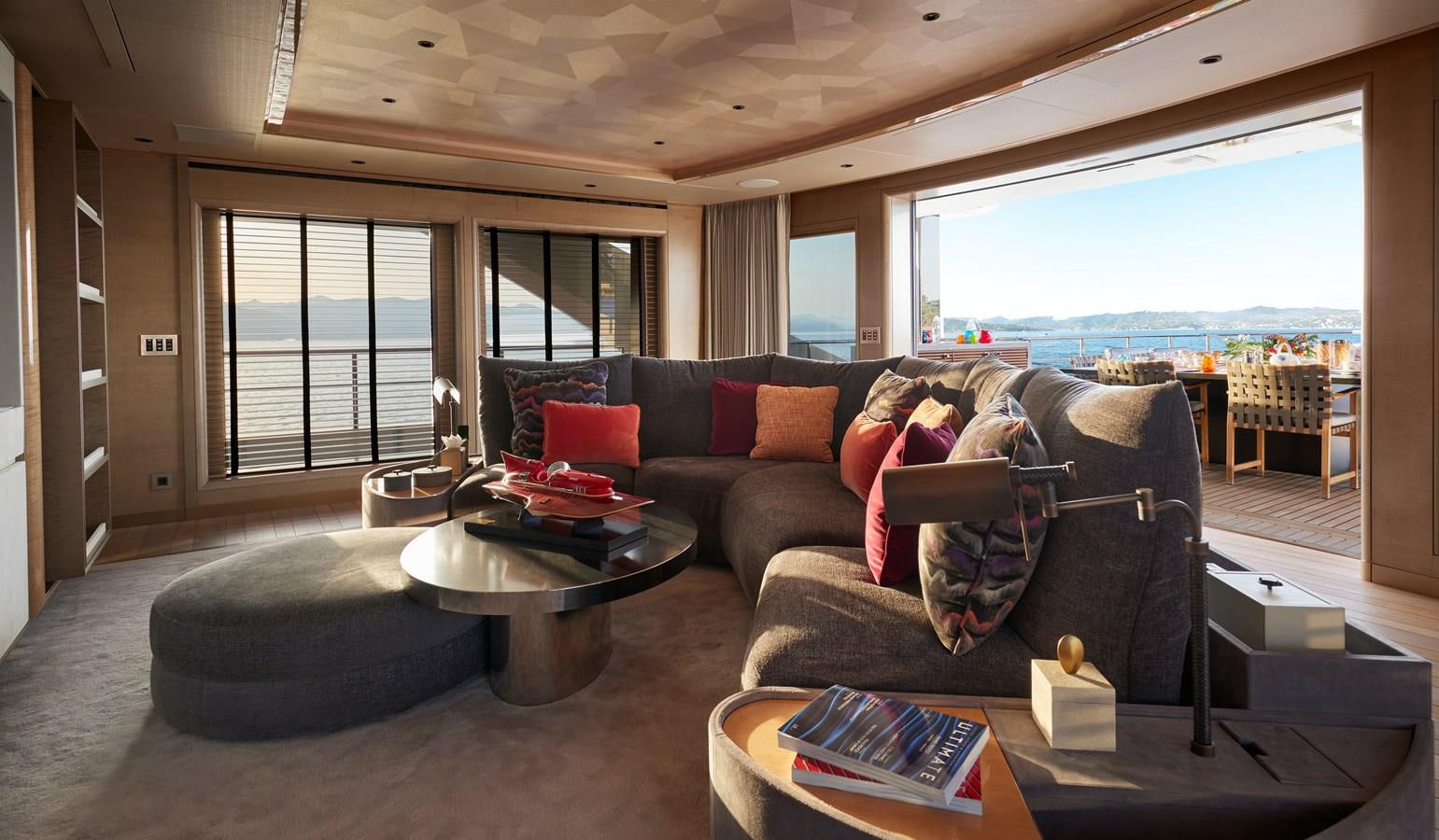 a living room with a couch and a coffee table aboard SOMNIUM Yacht for Sale