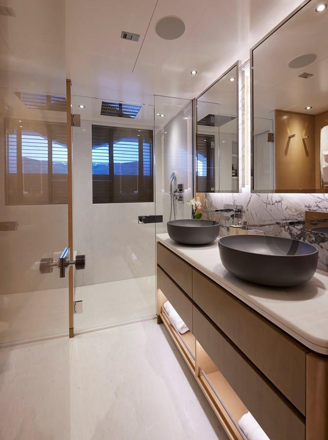 a bathroom with a sink and a mirror aboard SOMNIUM Yacht for Sale