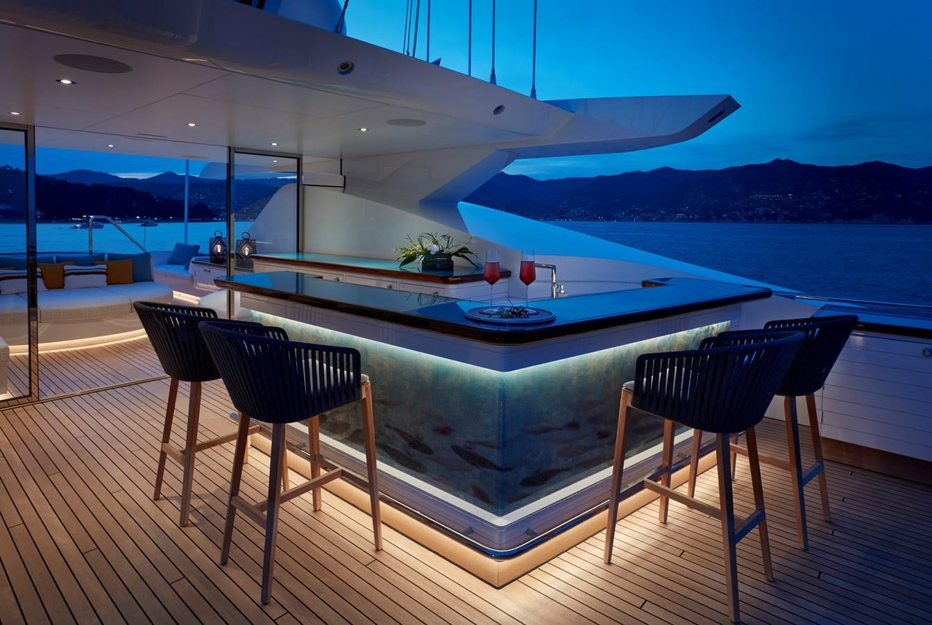 a pool with a table and chairs aboard SOMNIUM Yacht for Sale
