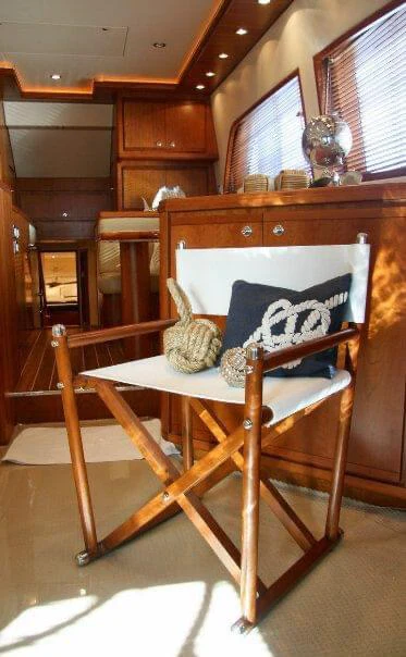 a wooden chair in a room aboard ISAKINDOFMAGIC Yacht for Sale