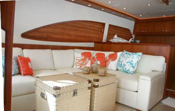 a living room with a couch and a bed aboard ISAKINDOFMAGIC Yacht for Sale