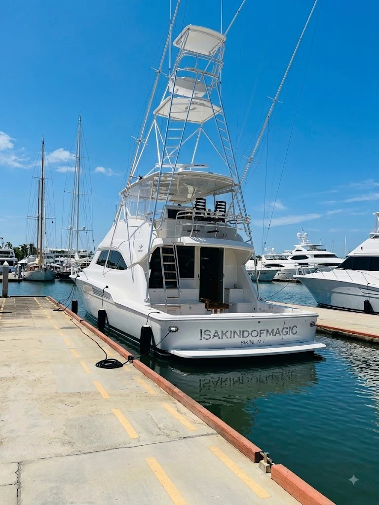 a boat docked at a pier aboard ISAKINDOFMAGIC Yacht for Sale