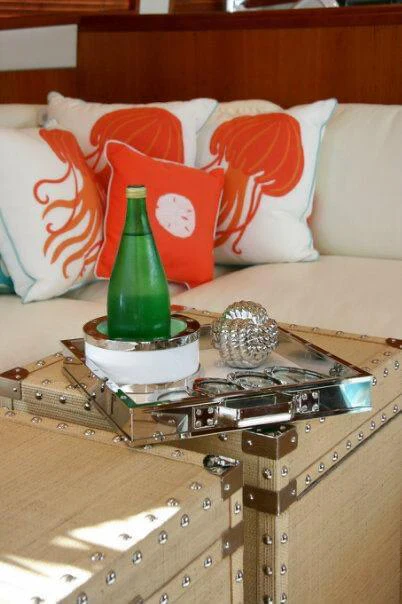a glass bottle on a table aboard ISAKINDOFMAGIC Yacht for Sale