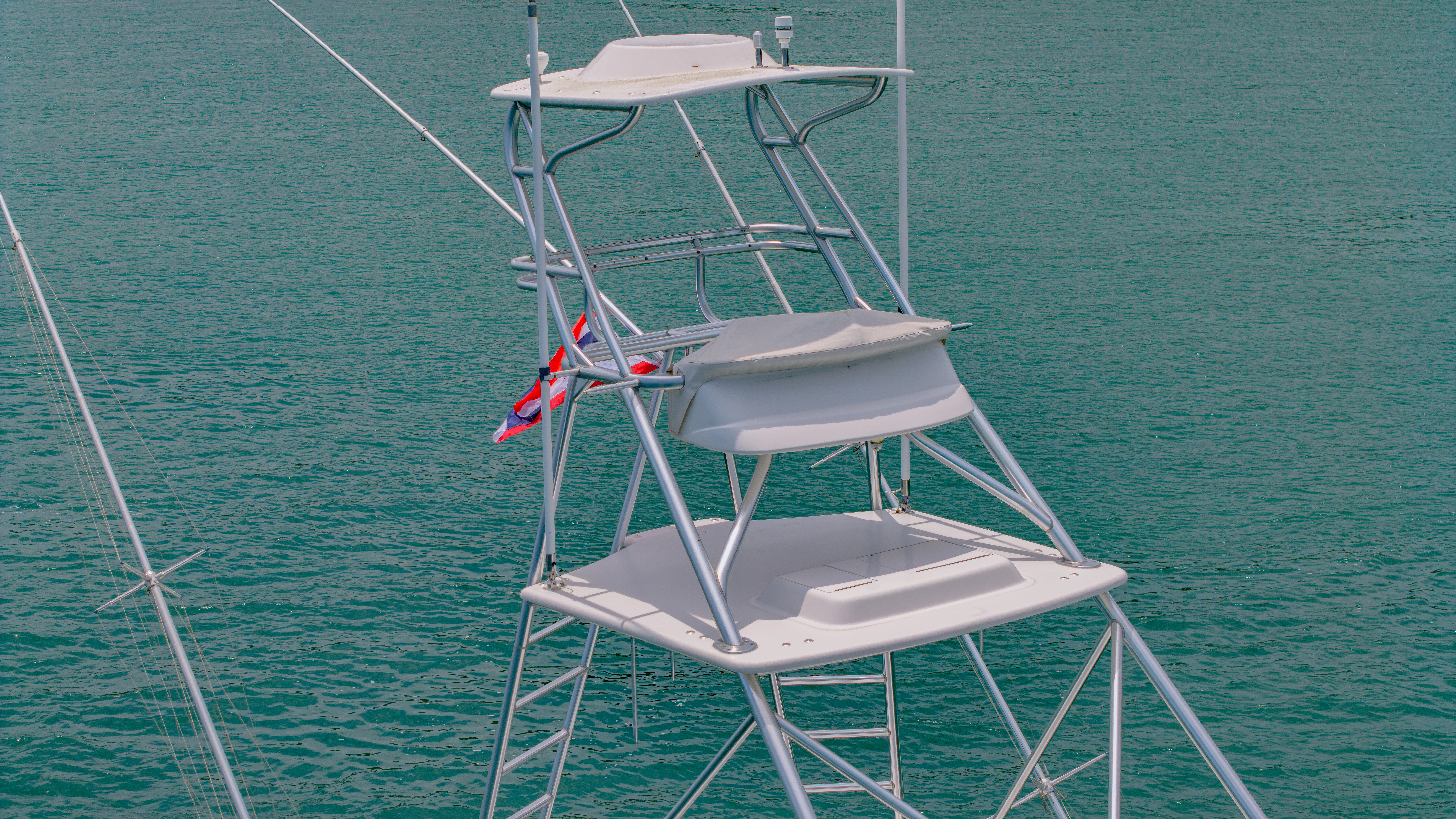 a white chair on a boat aboard ISAKINDOFMAGIC Yacht for Sale