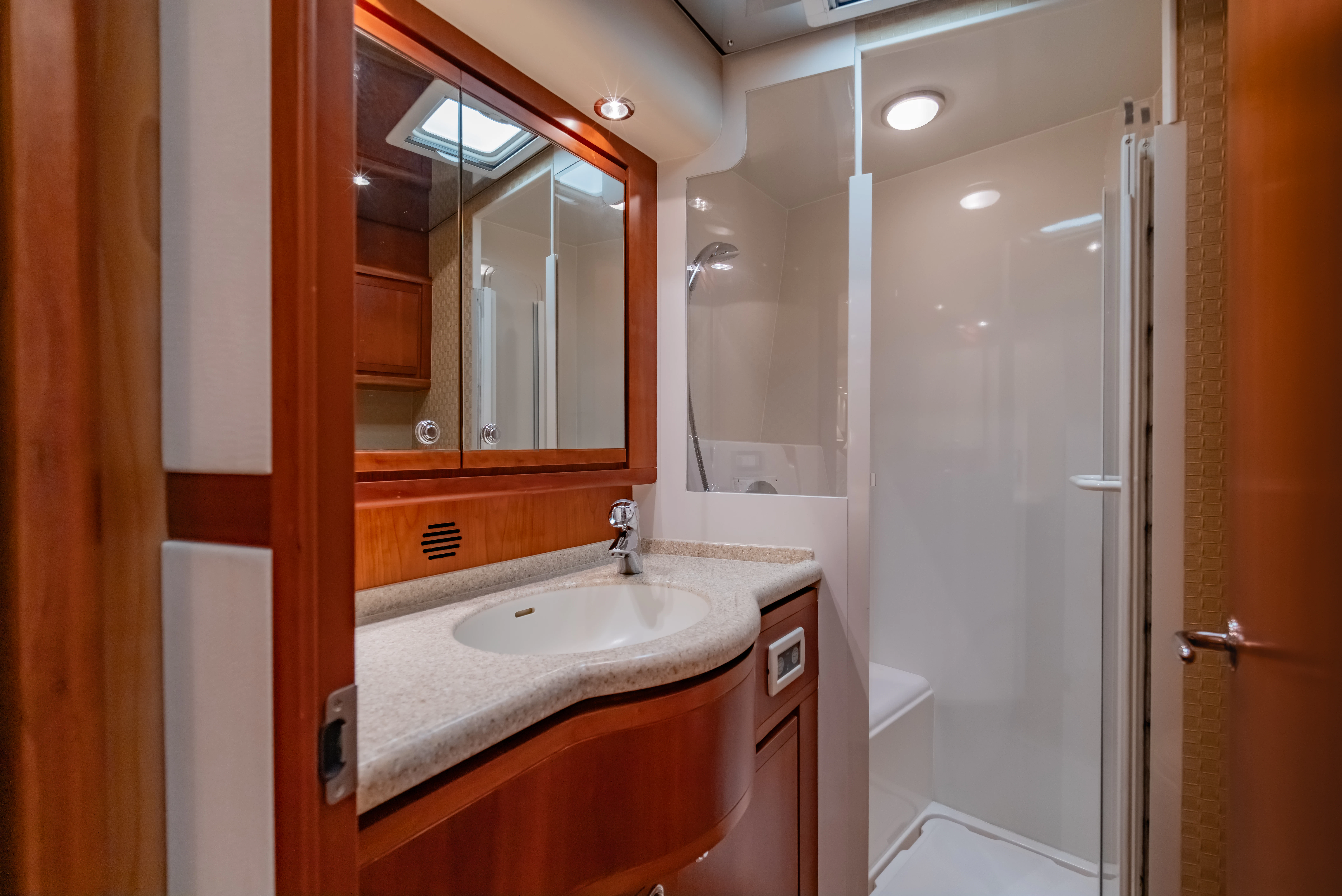 a bathroom with a sink and a shower aboard ISAKINDOFMAGIC Yacht for Sale