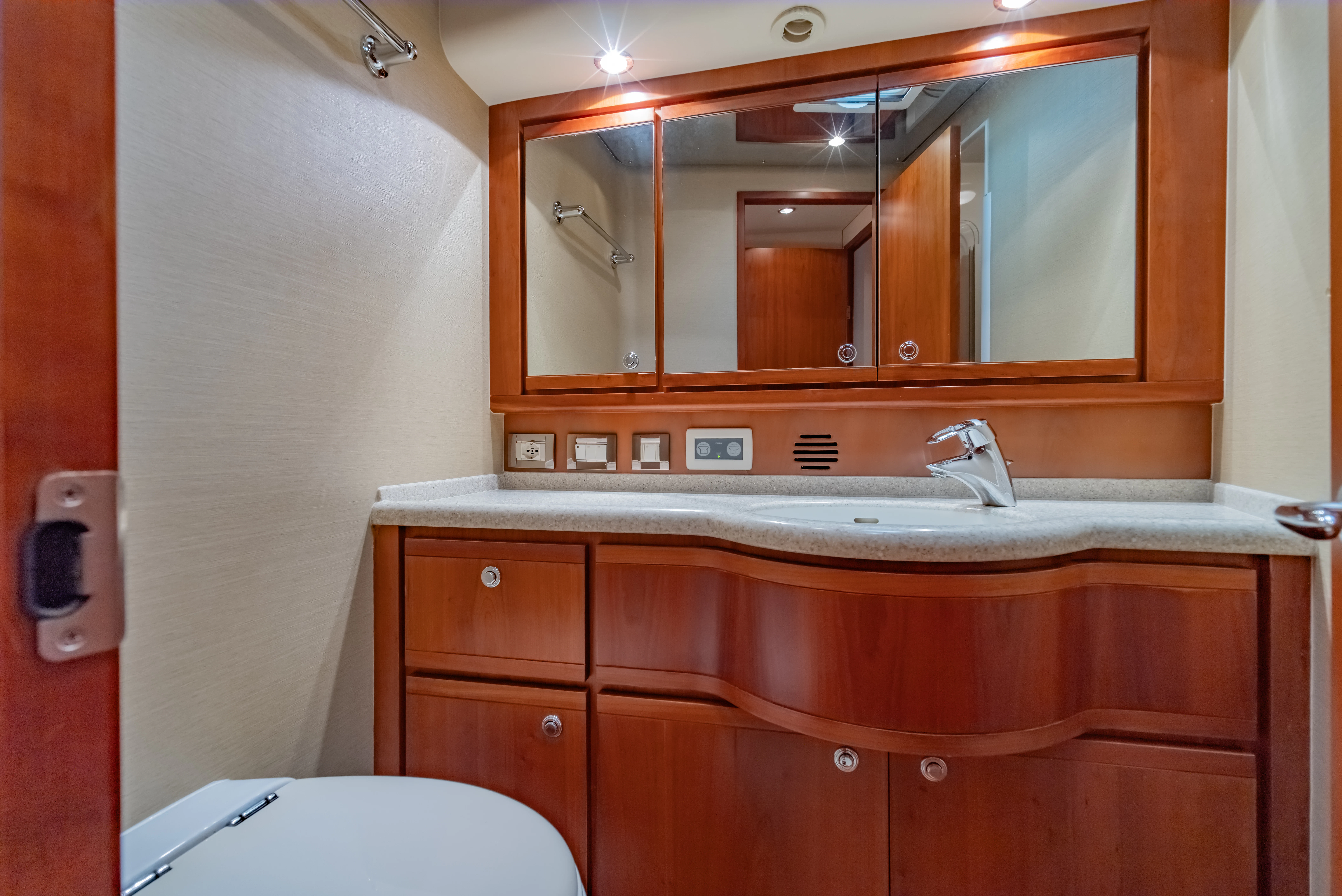 a bathroom with a large mirror aboard ISAKINDOFMAGIC Yacht for Sale