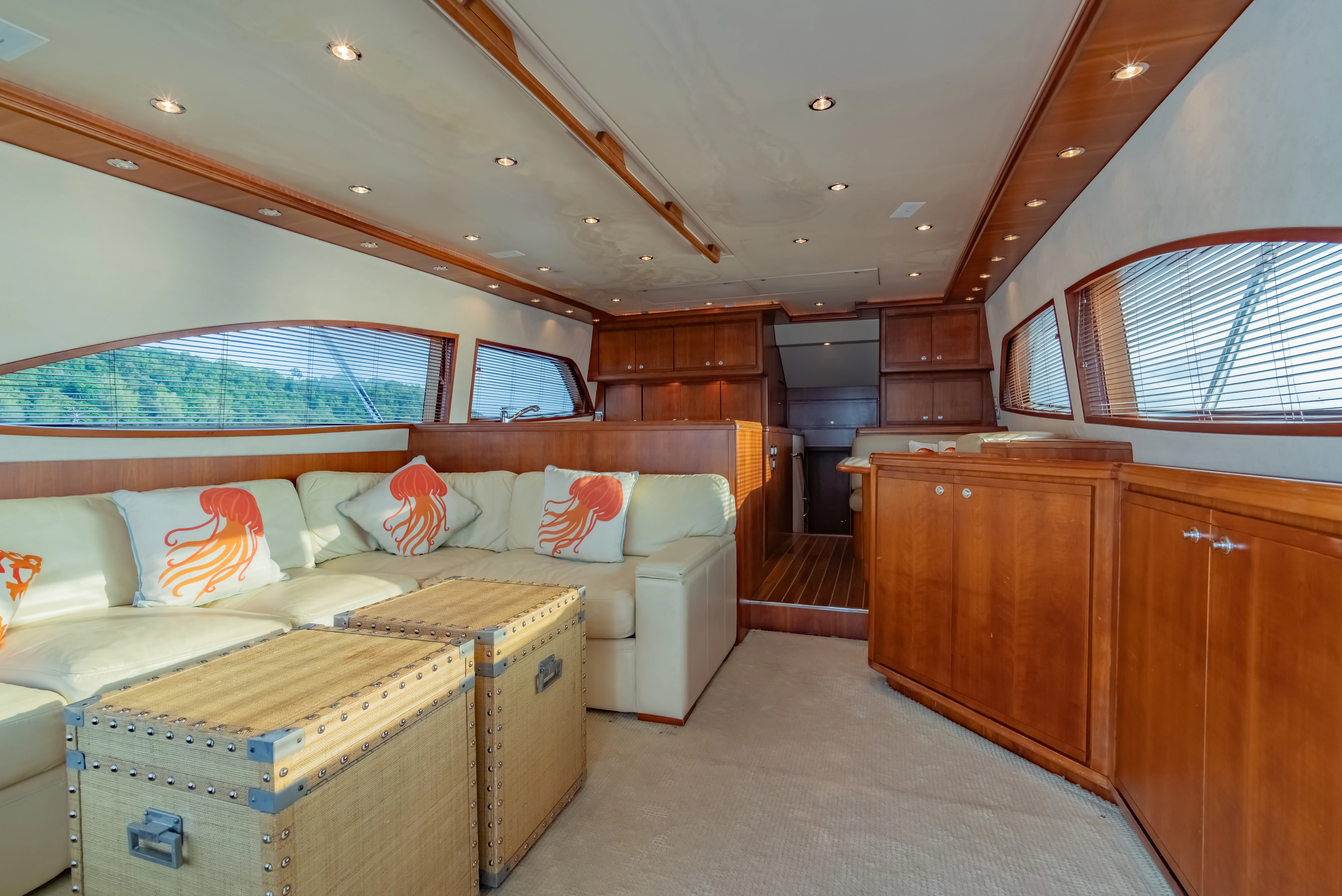 a bedroom with a bed and a dresser aboard ISAKINDOFMAGIC Yacht for Sale