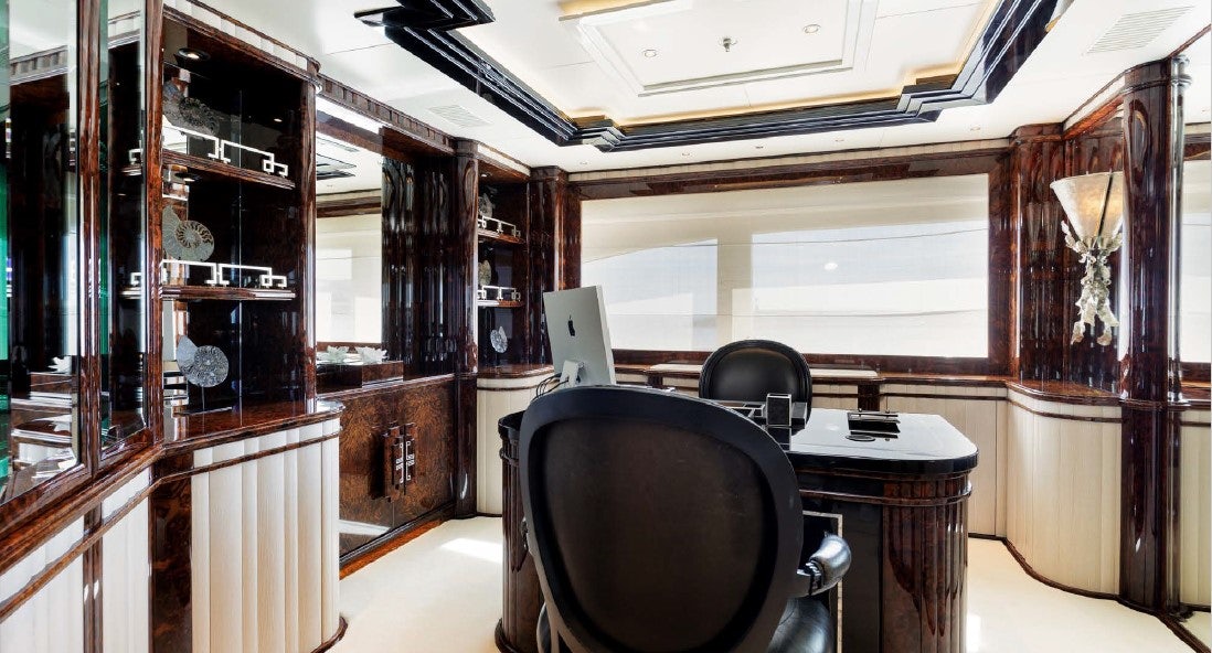 a room with a desk and a computer aboard LIONESS V Yacht for Sale