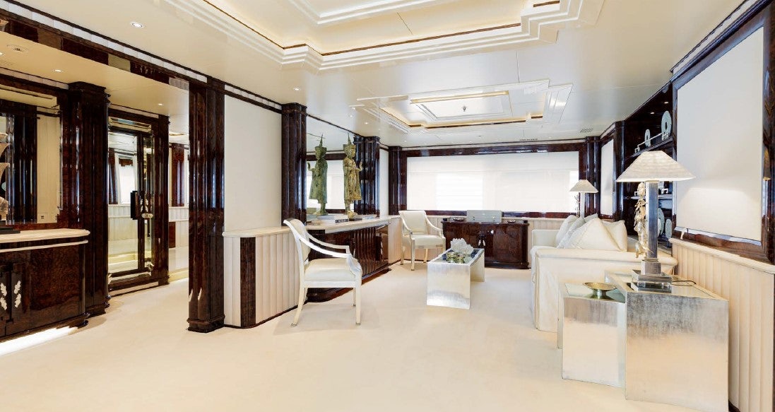 a room with a couch and a table and chairs aboard LIONESS V Yacht for Sale