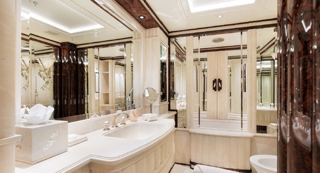 a bathroom with a large mirror aboard LIONESS V Yacht for Sale