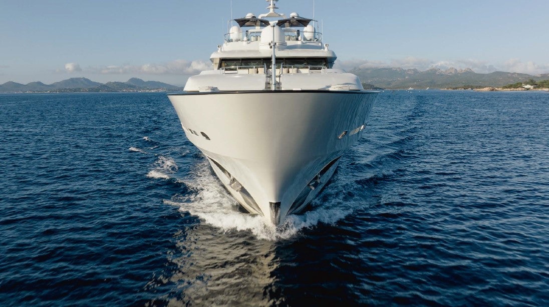 a large white ship in the water aboard LIONESS V Yacht for Sale