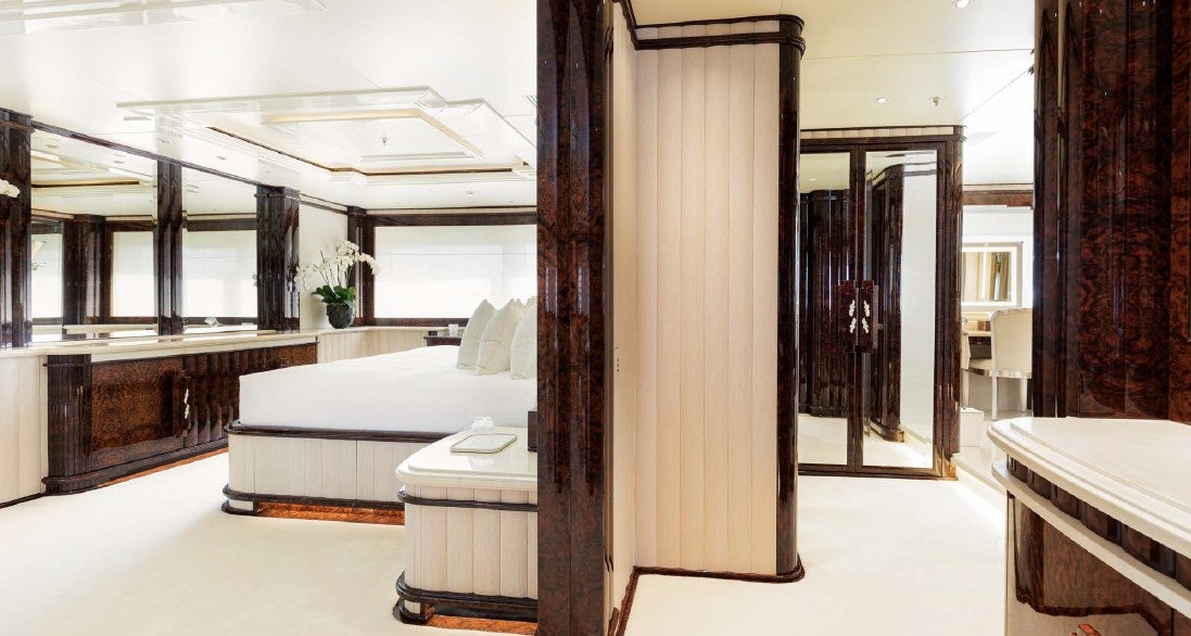 a room with a bed and a desk aboard LIONESS V Yacht for Sale