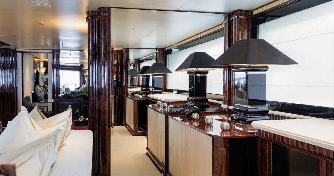 a room with a desk and a lamp aboard LIONESS V Yacht for Sale