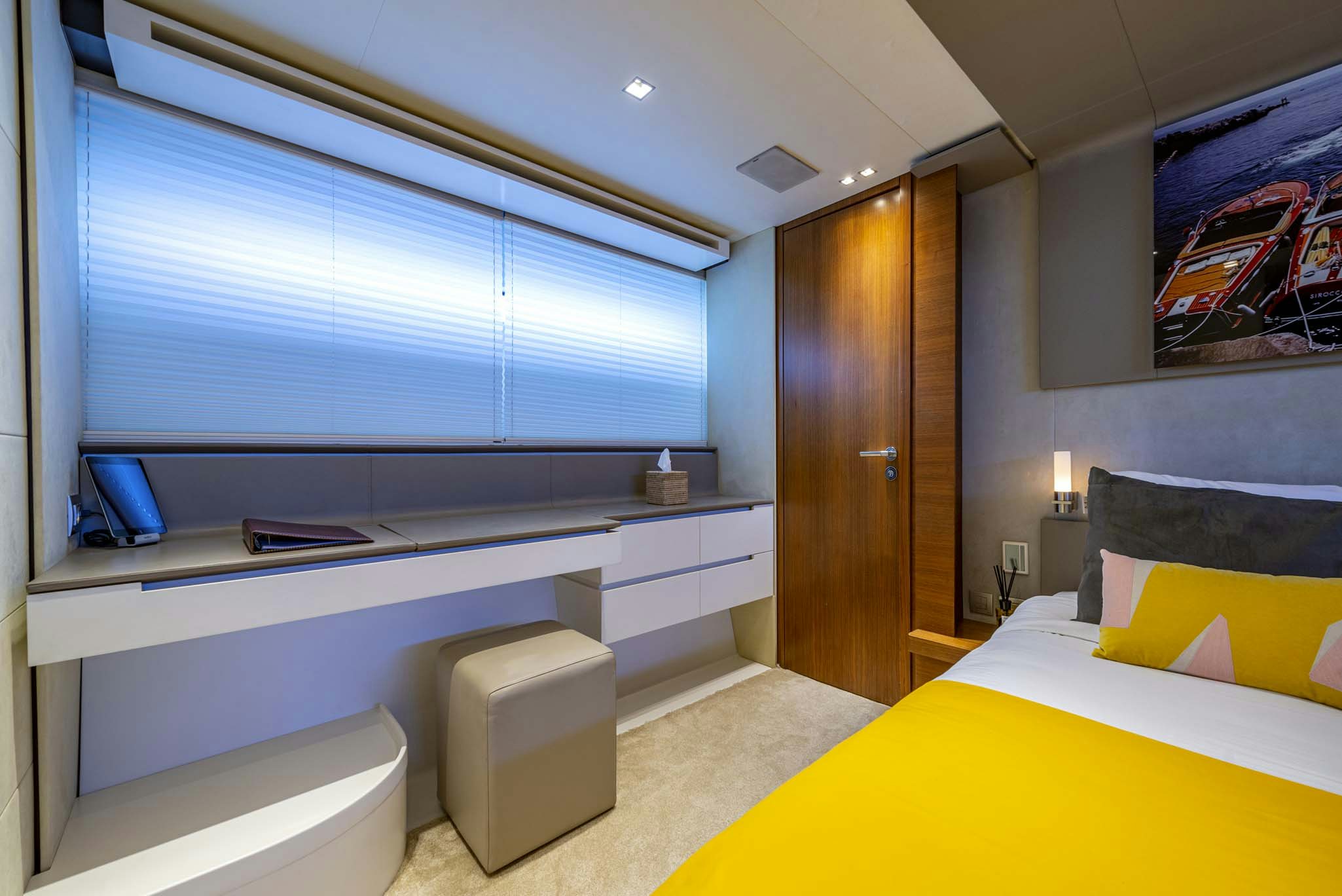a room with a bed and a desk aboard QUANTUM Yacht for Charter