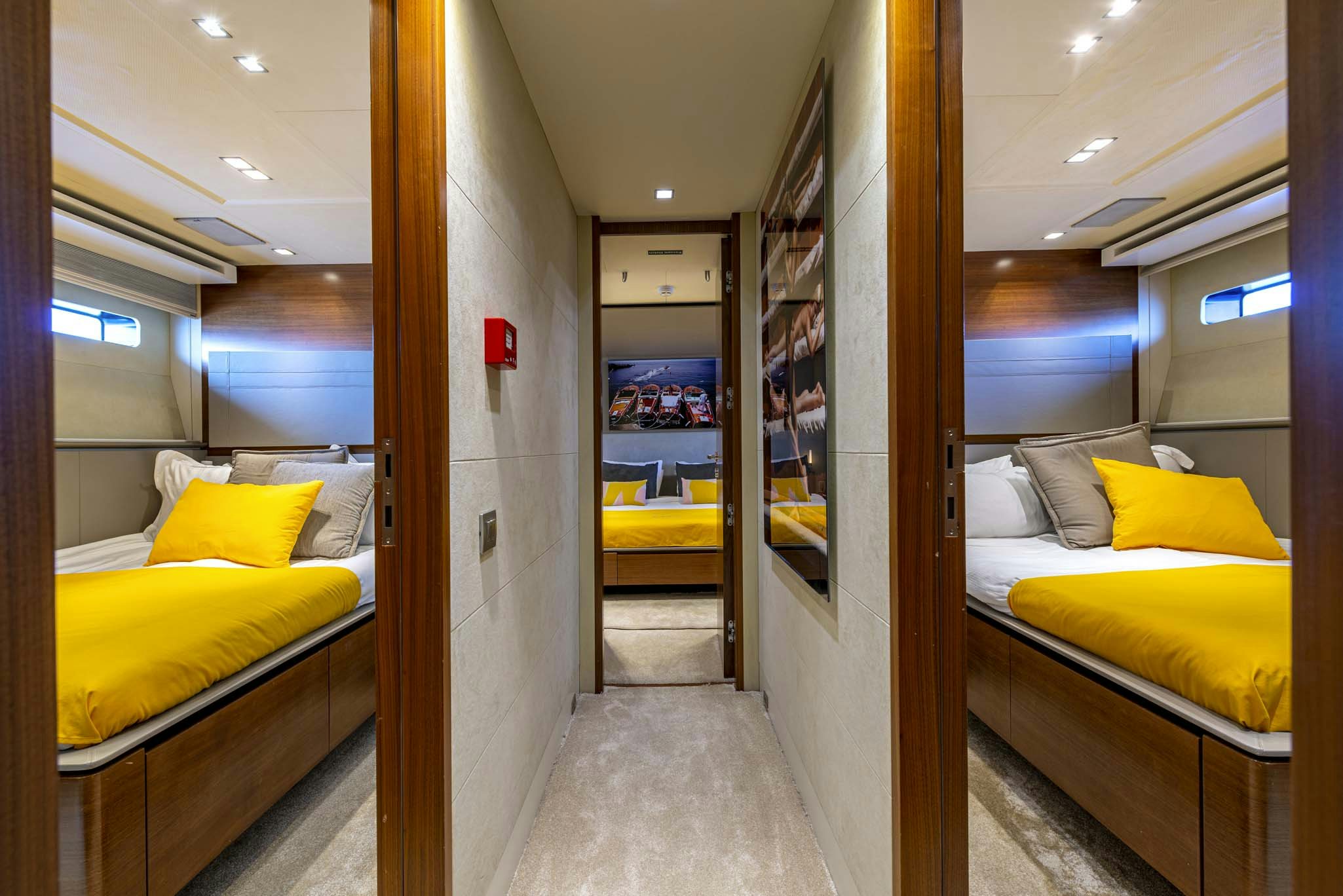 a room with a bed and a mirror aboard QUANTUM Yacht for Charter