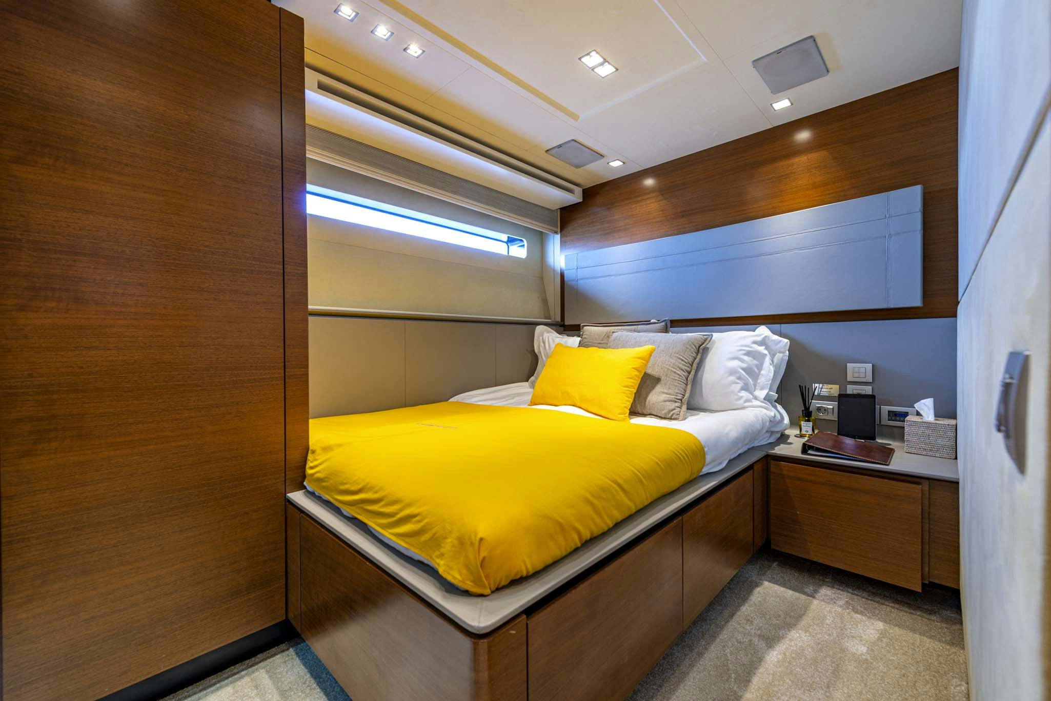 a bed in a room aboard QUANTUM Yacht for Charter