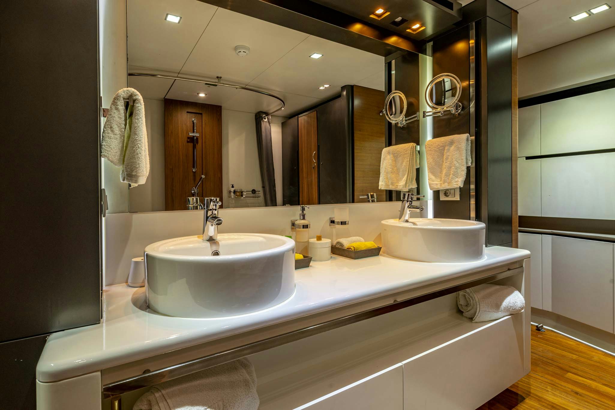 a bathroom with a large mirror aboard QUANTUM Yacht for Charter