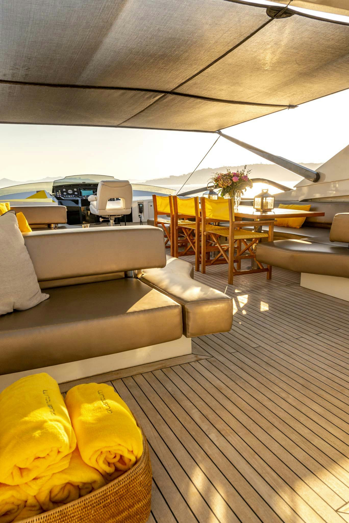 a room with couches and a table aboard QUANTUM Yacht for Charter