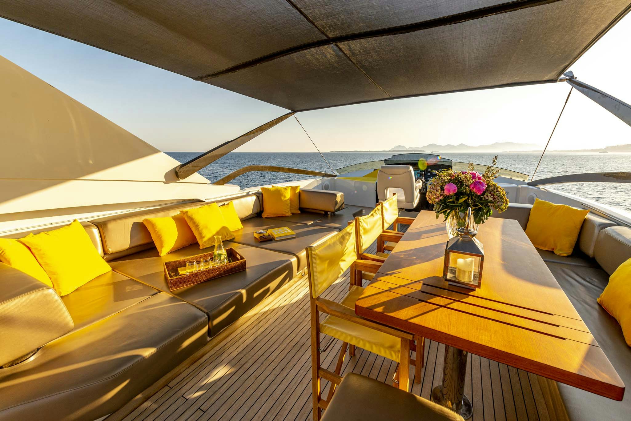 a boat with a table and chairs aboard QUANTUM Yacht for Charter