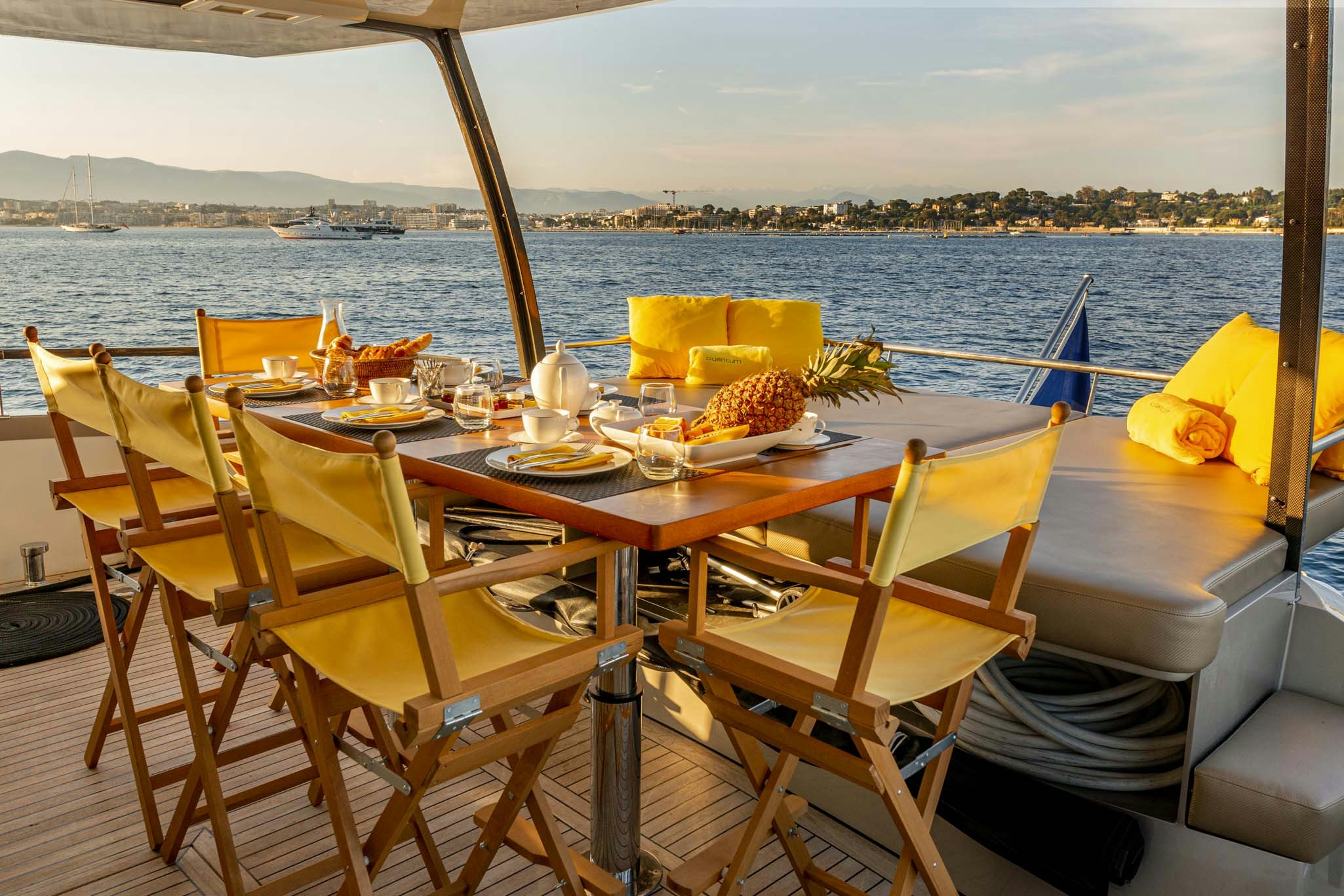 a table set for a meal on a boat aboard QUANTUM Yacht for Charter