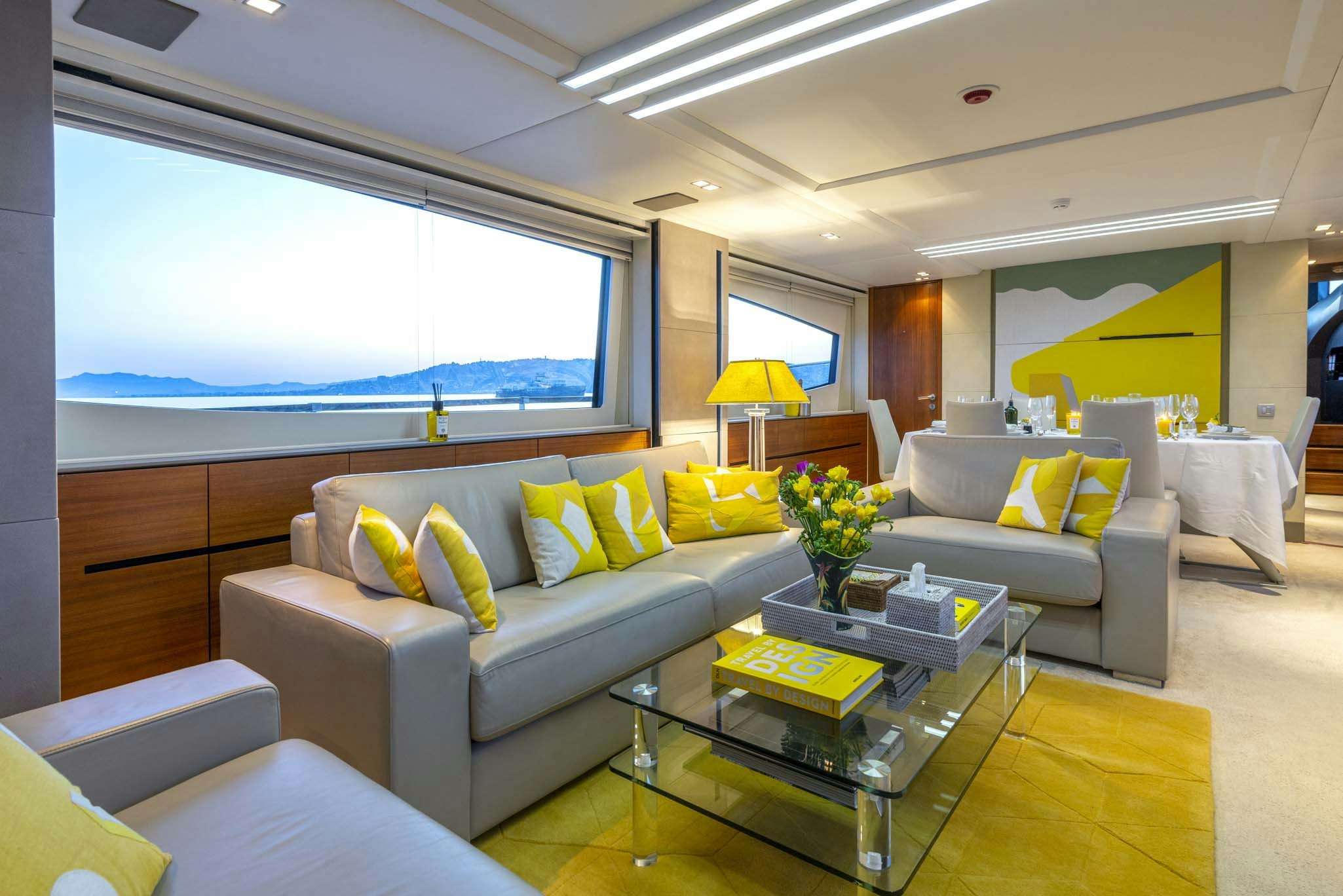 a living room with a large window aboard QUANTUM Yacht for Charter