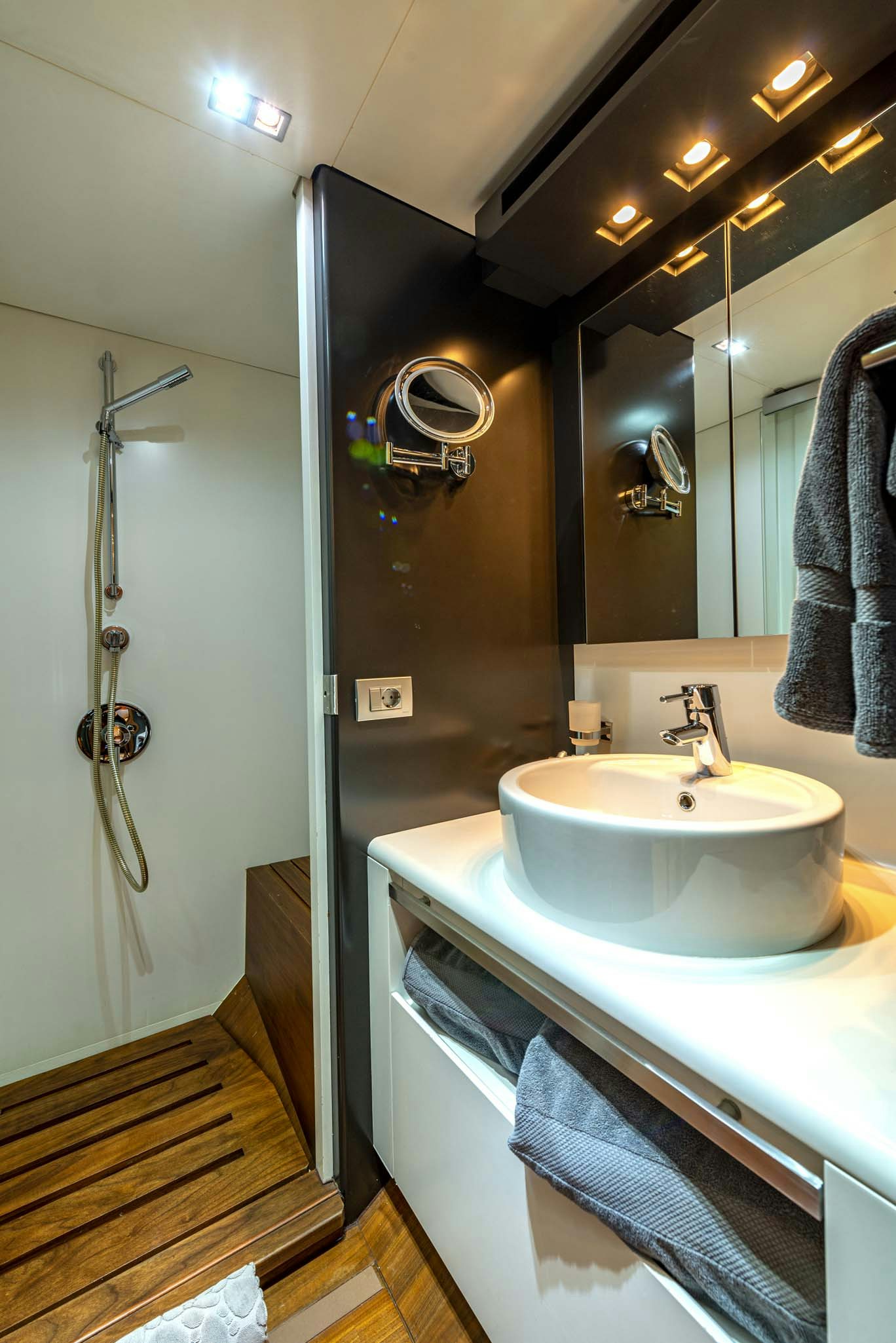 a bathroom with a sink and a shower aboard QUANTUM Yacht for Charter