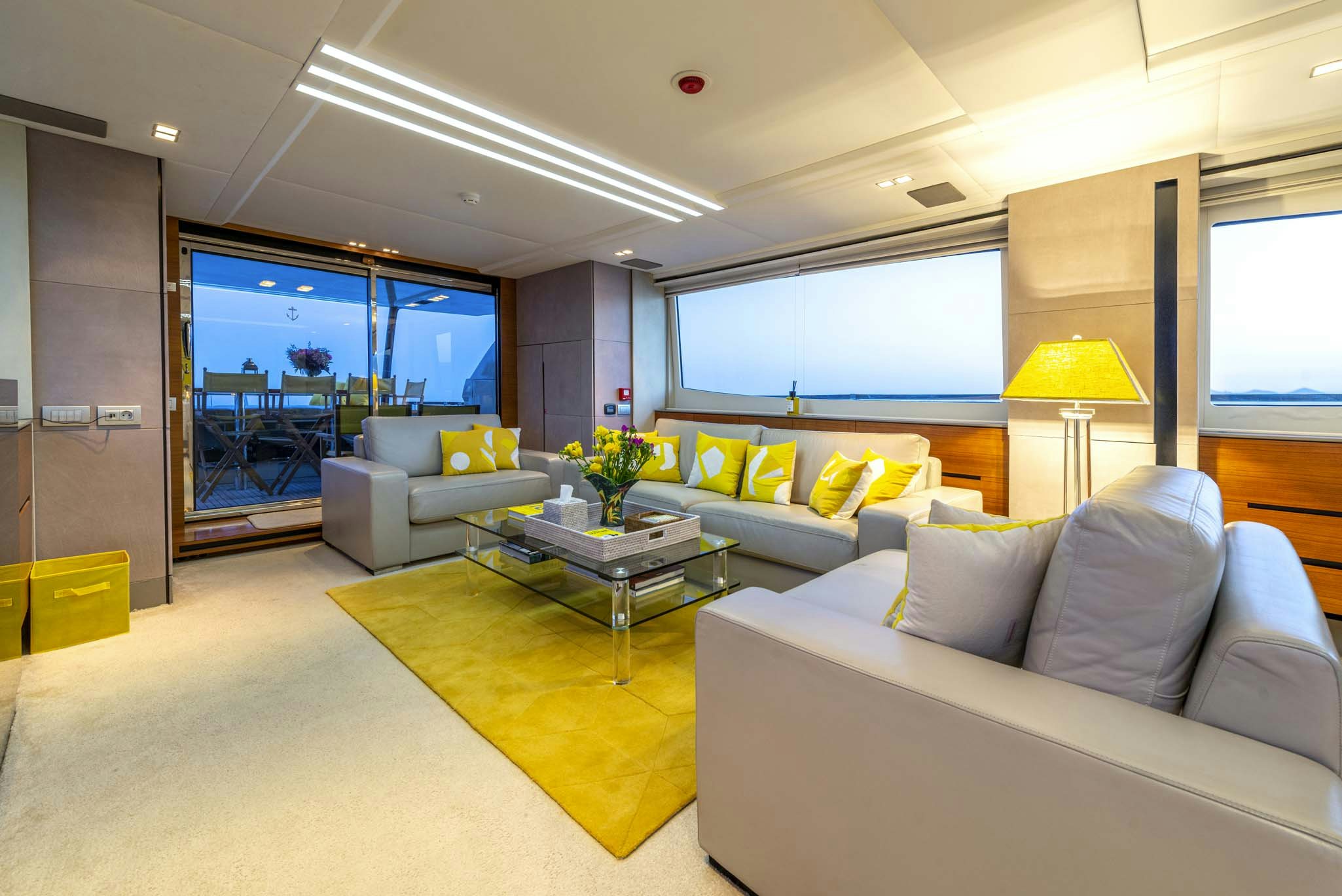 a living room with a couch and a coffee table aboard QUANTUM Yacht for Sale