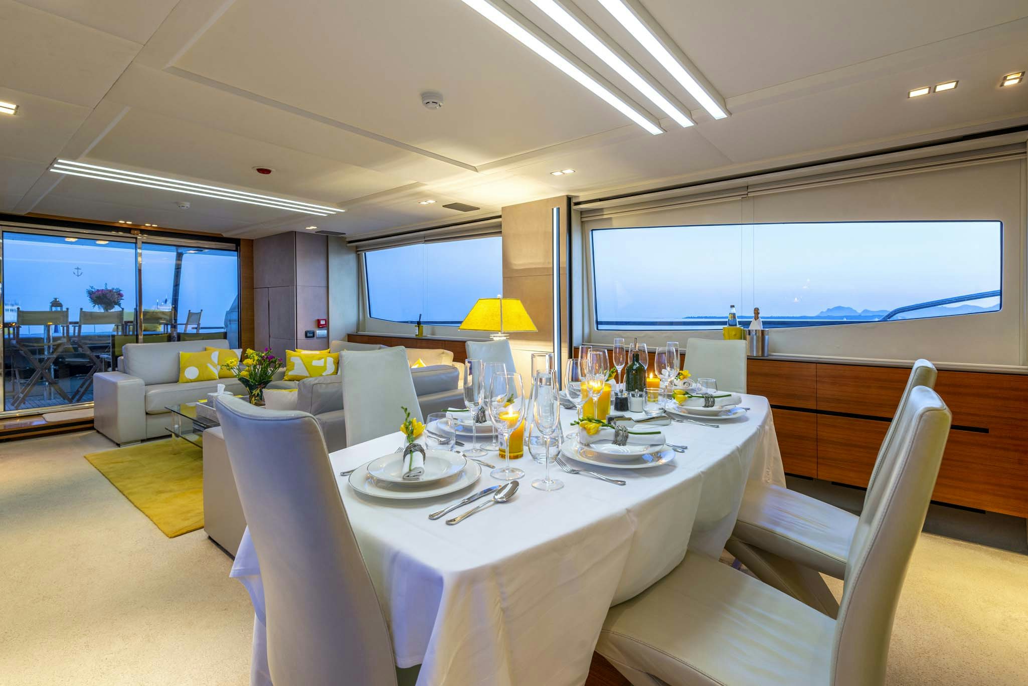 a room with a table and chairs aboard QUANTUM Yacht for Sale