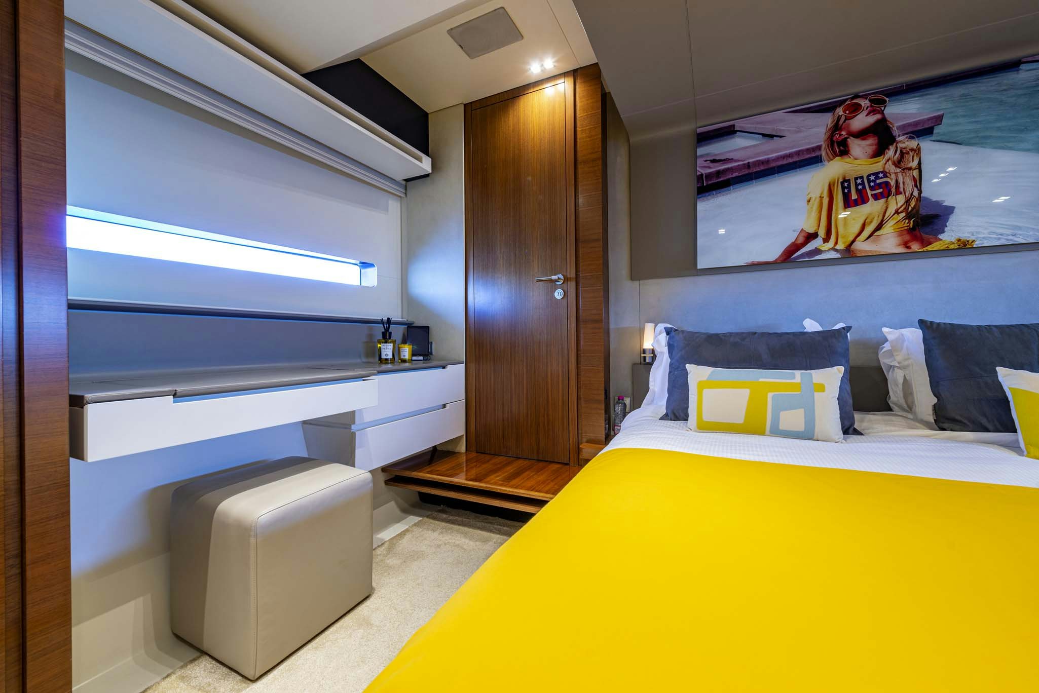 a room with a bed and a wood door aboard QUANTUM Yacht for Sale